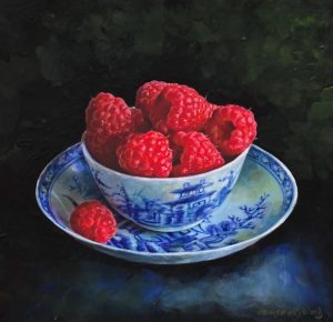 Raspberries in a blue bowl